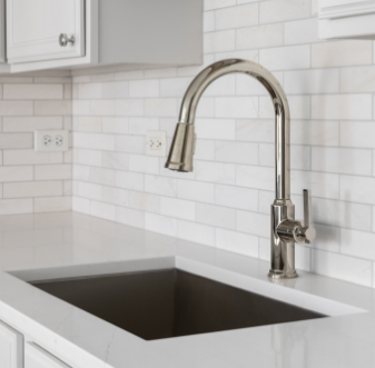 Brushed nickel faucet over an undermount kitchen sink
