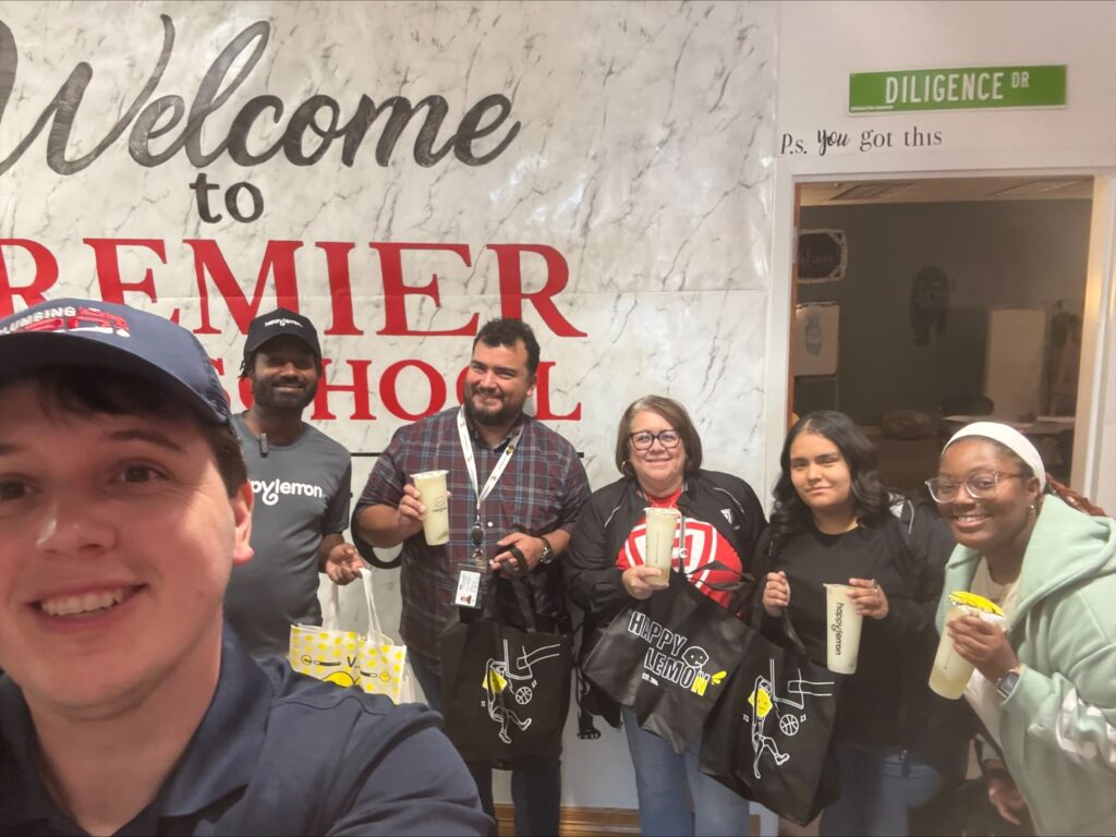 Plumbing crew members participating in Austin community engagement and outreach event