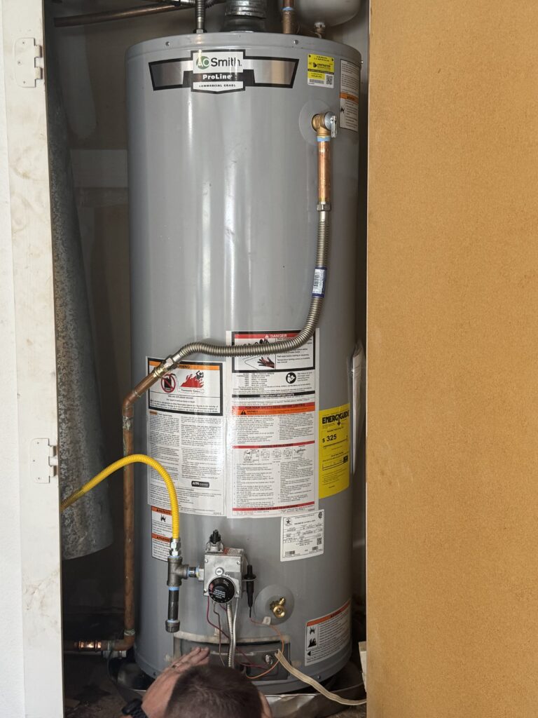 Newly installed gas tank water heater in a closet