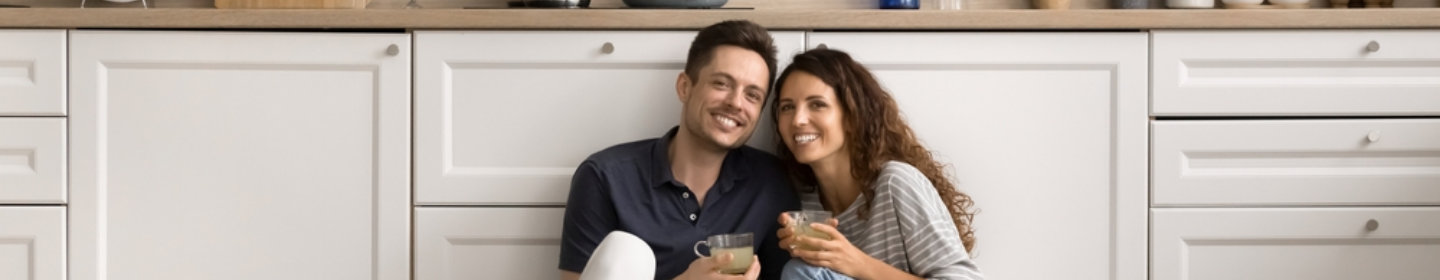 Couple sitting together in a kitchen