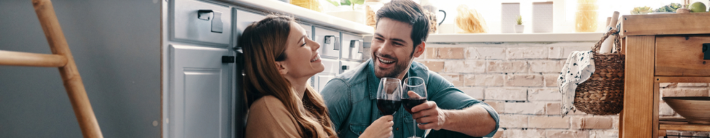 Couple talking in a kitchen