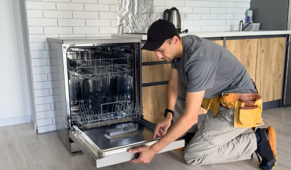 Technician installing a dishwasher