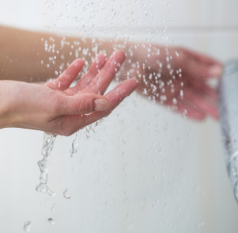 Hands under running water