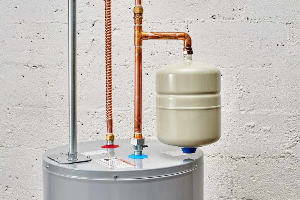 Expansion tank installed on top of a water heater