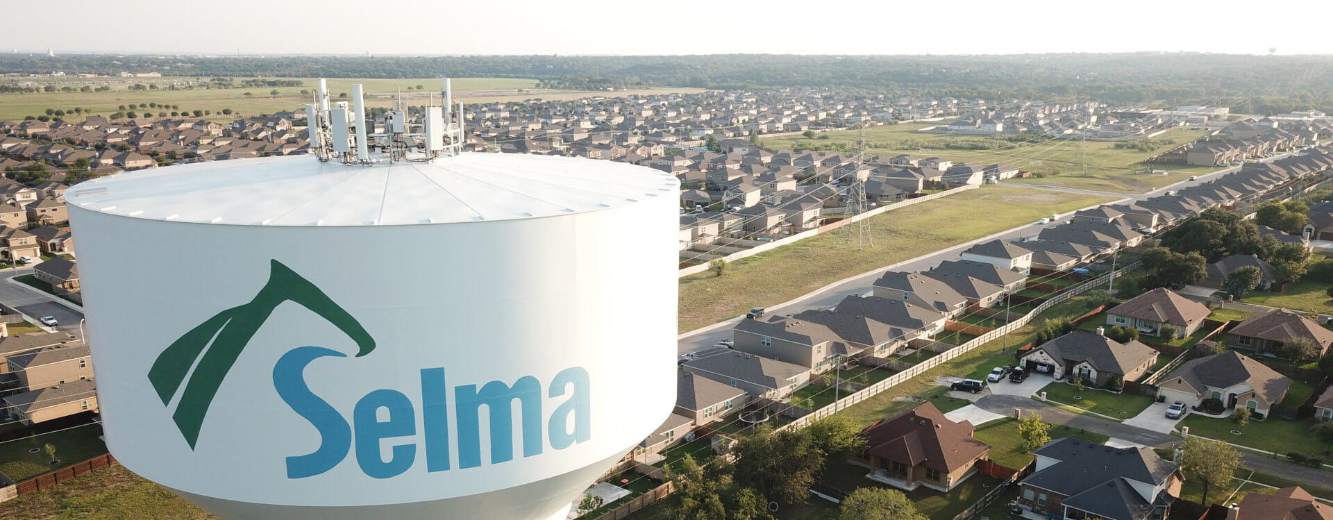 Selma water tower above a residential neighborhood