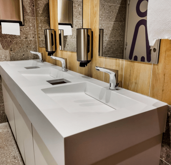 Commercial restroom vanity with several sinks
