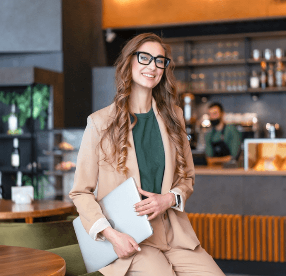 Business owner holding a tablet in a restaurant