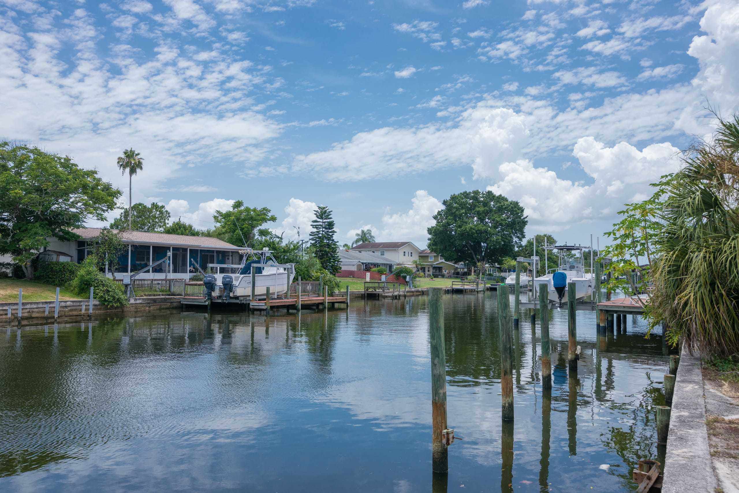 Waterfront homes and boat docks on a calm canal
